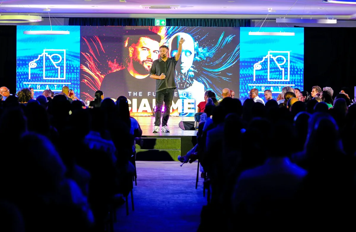 Speaker on stage addressing an audience
